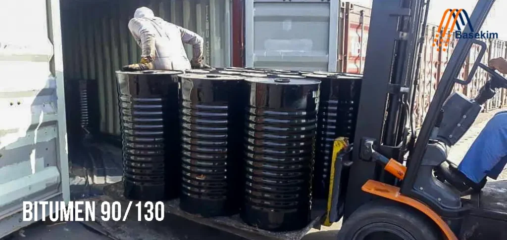 Close-up view of Bitumen 90-130 in solid form, showing its dark, glossy texture suitable for road construction and waterproofing applications.