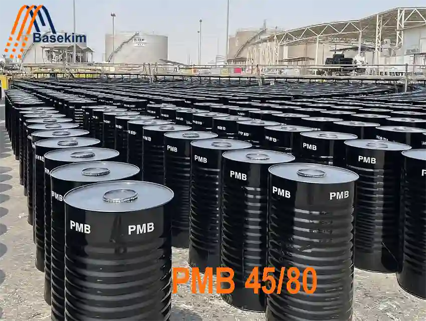 Basekim PMB 45/80 steel drums stacked at industrial facility for export