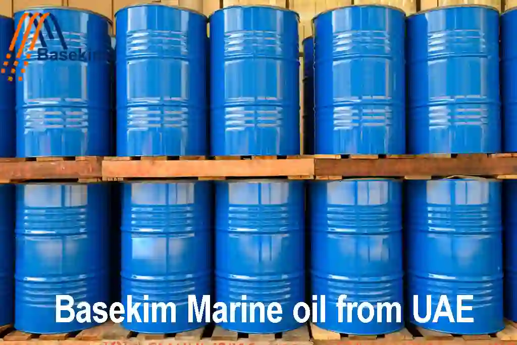 Blue steel drums of Basekim marine oil stacked on pallets for export from UAE.