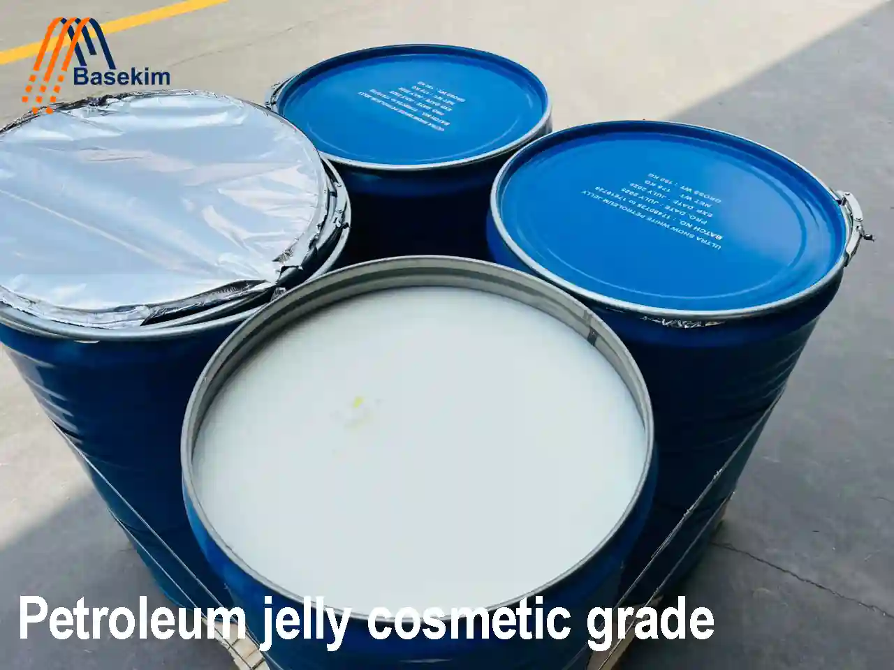 Blue industrial drums filled with petroleum jelly cosmetic grade supplied by Basekim in UAE and Turkey.