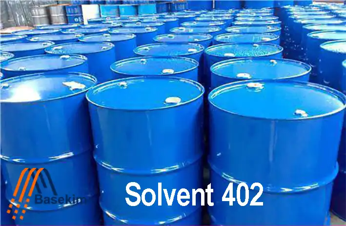 Blue steel drums filled with Solvent 402, stored in rows for industrial supply by Basekim.