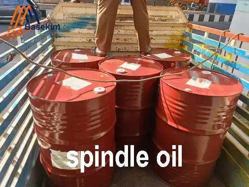 Red steel drums of spindle oil loaded on a truck for shipment by Basekim.