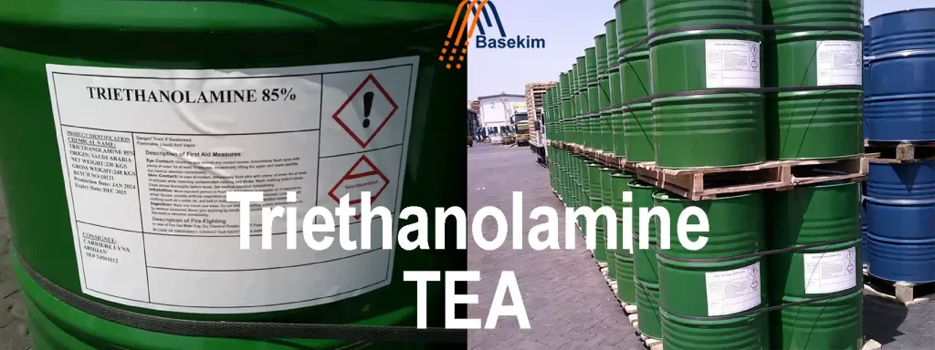 Green steel drums labeled "Triethanolamine 85%" stacked on pallets at Basekim's export yard.