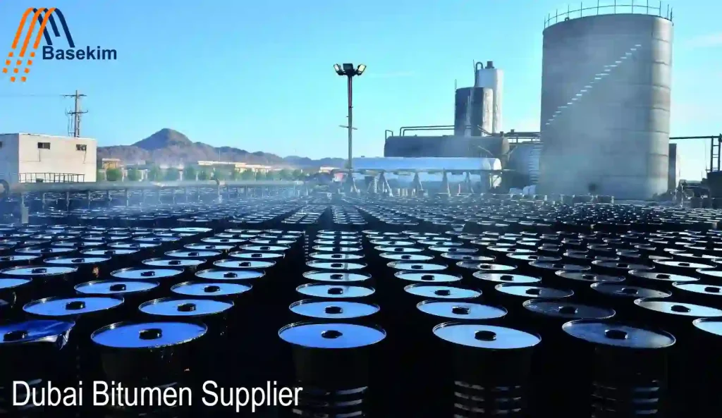 Dubai Bitumen Supplier facility with rows of steel drums ready for export, managed by Basekim for African and global markets.
