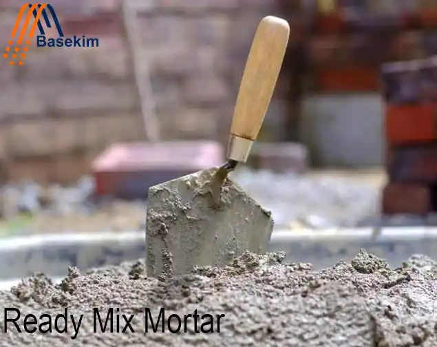 Close-up of ready mix mortar with a trowel, supplied by Basekim for construction projects.